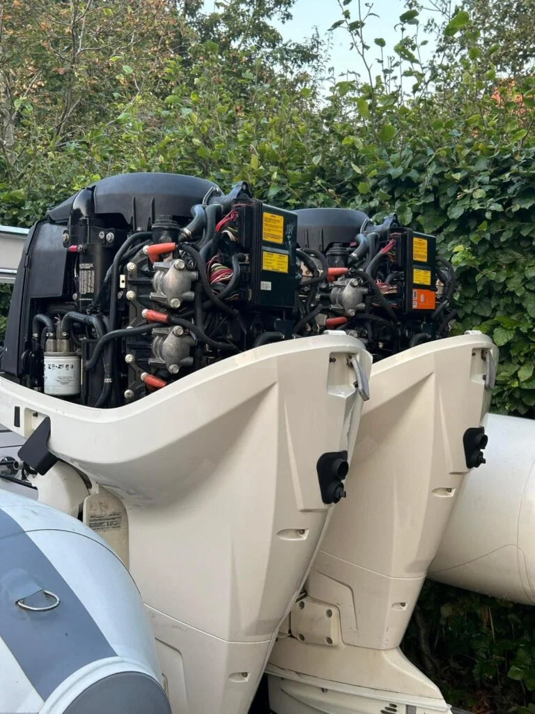 Dr Evinrude working on an engine with a Hardware Care EMM